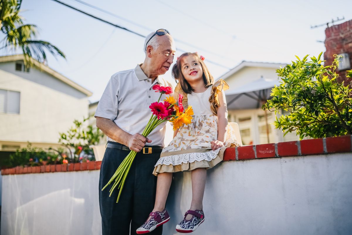 Grandfather and granddaughter — legacy passed across generations